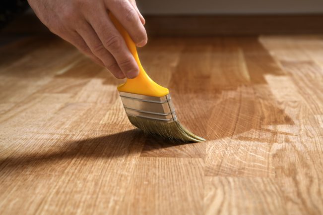 Varnishing,Lacquering,Parquet,Floor,By,Paintbrush,-,Second,Layer.,Home